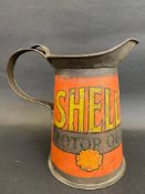 An early Shell Motor Oil wide neck quart measure.