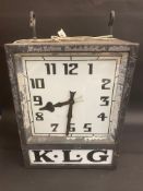 A K.L.G. garage forecourt double sided hanging clock of unusual and attractive form, in very