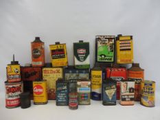 A quantity of assorted oil cans and tins.
