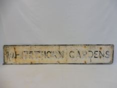 A street name sign for Whitethorn Gardens, 61 1/2 x 11".