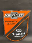 A Chevrolet Trucks Authorised Dealer shield-shaped enamel sign by Franco with four small spots of