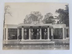 A fabulous period photograph of Weston Green Service Station, with a row of four petrol pumps