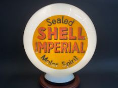 A rare Shell Imperial Motor Spirit glass petrol pump globe, stamped 'Foreign'.