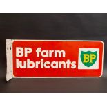 A BP Farm Lubricants double sided tin advertising sign with hanging flange, 20 1/2 x 8 1/2".