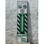 A Duckham's Adcoids black and white enamel thermometer, 11 x 45".