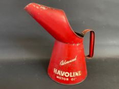 A Havoline Motor Oil half gallon measure.