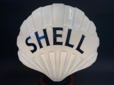 A 'Fat' Shell glass petrol pump globe in exceptional condition, still with registration number on