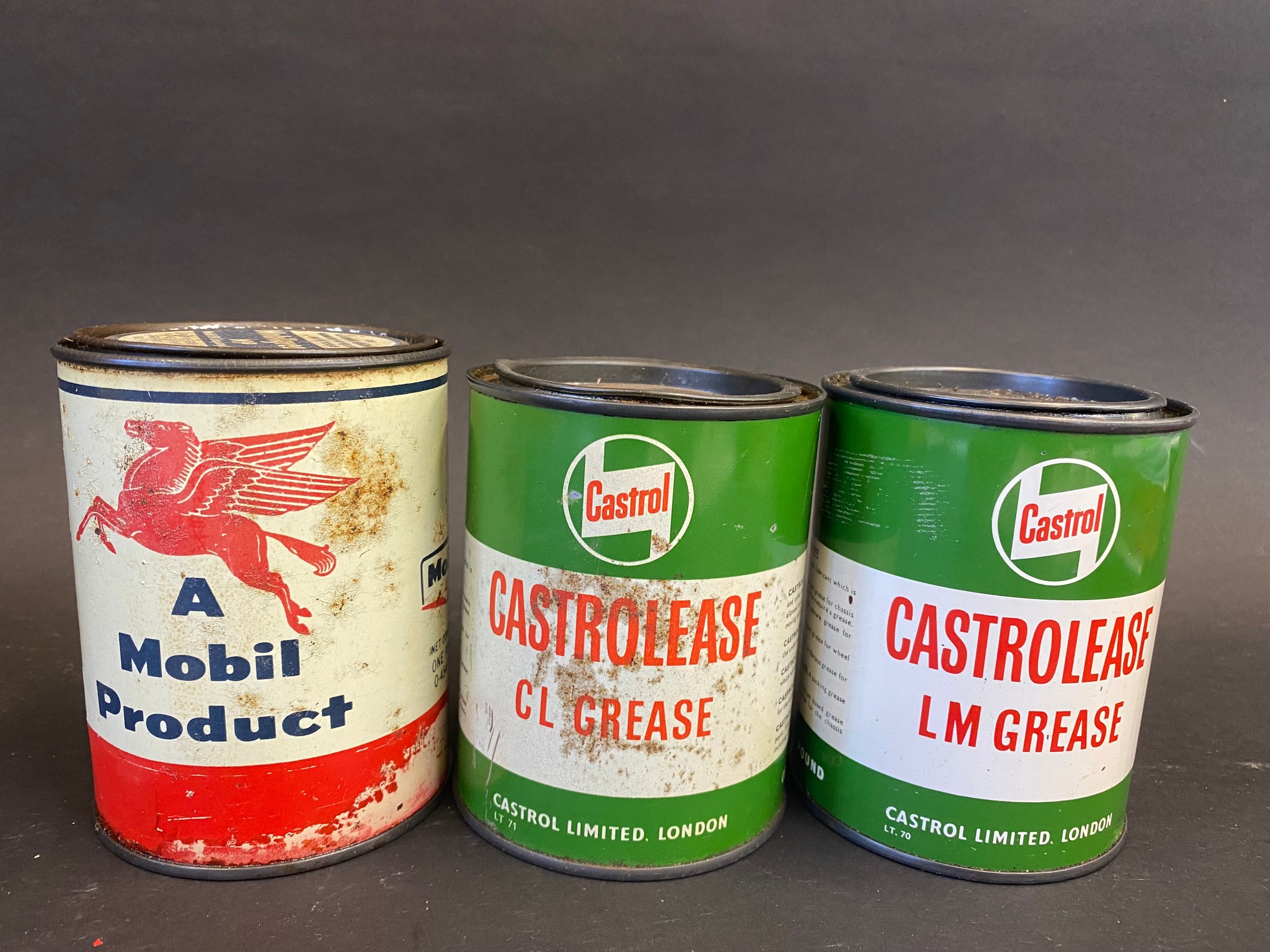 Two Castrolease grease tins and a third for Mobilgrease.