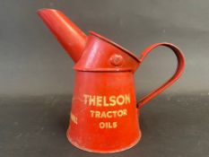 A Thelson Tractor Oils pint measure, in good condition.