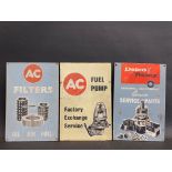 Three hardboard advertising sign, two for AC (filters and fuel pumps) and one for Delco Remy, all