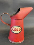 An Esso quart oil measure, in good condition.