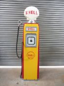 An Avery Hardoll 598 petrol pump restored in Shell livery with a plastic Shell globe.