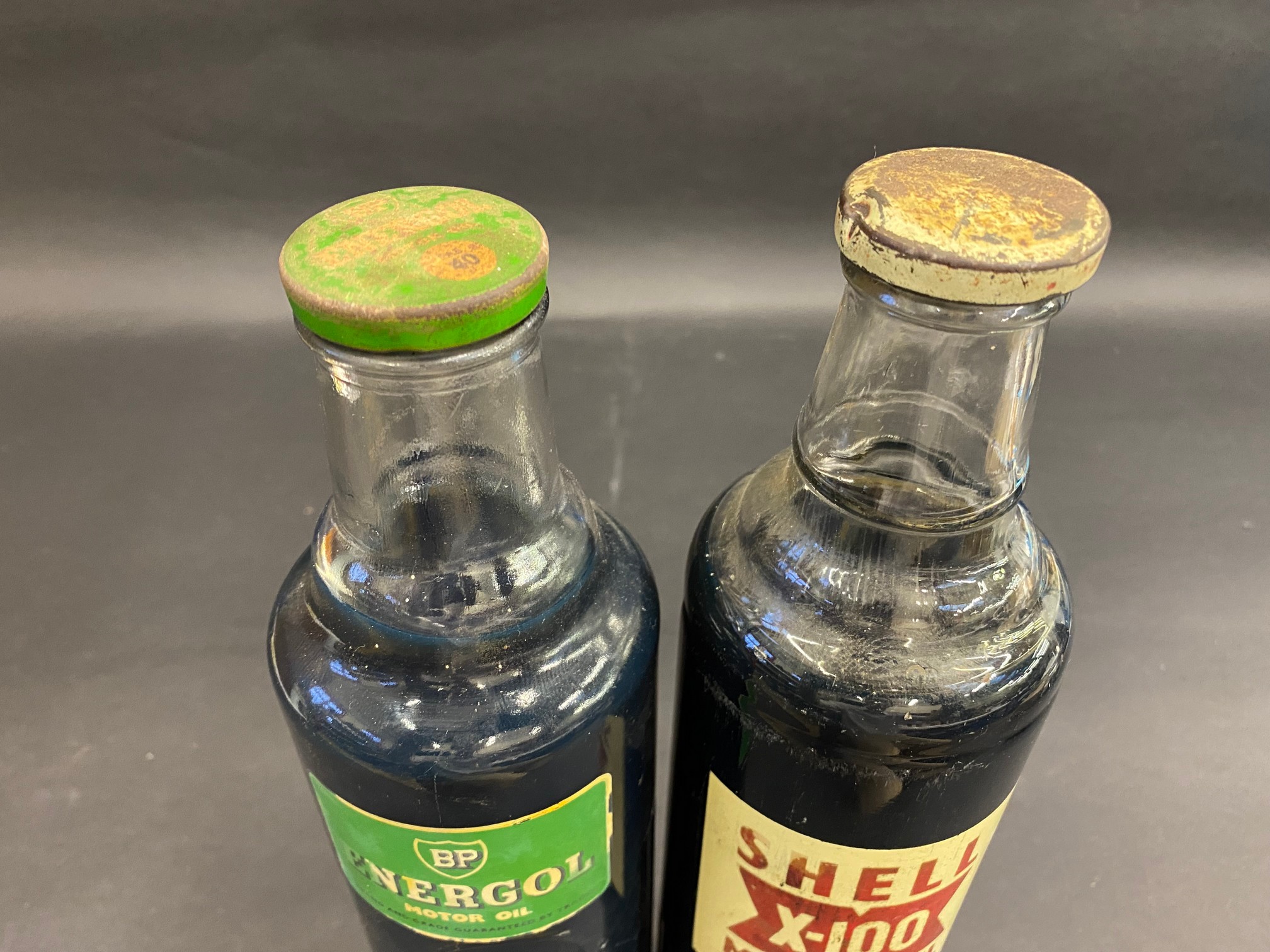 A Shell X-100 quart oil bottle plus a BP Energol quart bottle. - Image 2 of 2