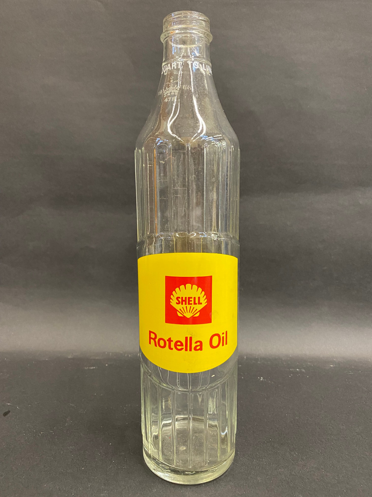 A Shell Rotella Oil quart oil bottle in excellent condition bearing coronet and date for 1966.