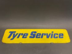 A rectangular tin pediment sign for 'Tyre Service', 24 x 5 1/2".