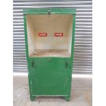 A green painted oil cabinet, lacking oil pumps, would convert to alternative storage uses.