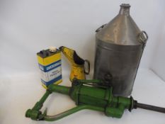 A five gallon conical can, an oil tank pump, an oil measure and a Duckhams can.