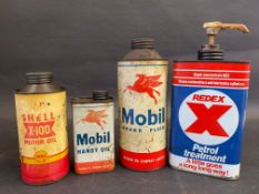 A Mobil Brake Fluid cylindrical quart can, a Redex quart can and two others.