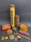 A box of mixed automobilia including cycle tins, Lucas oils, motoring tins, badges, key rings etc.