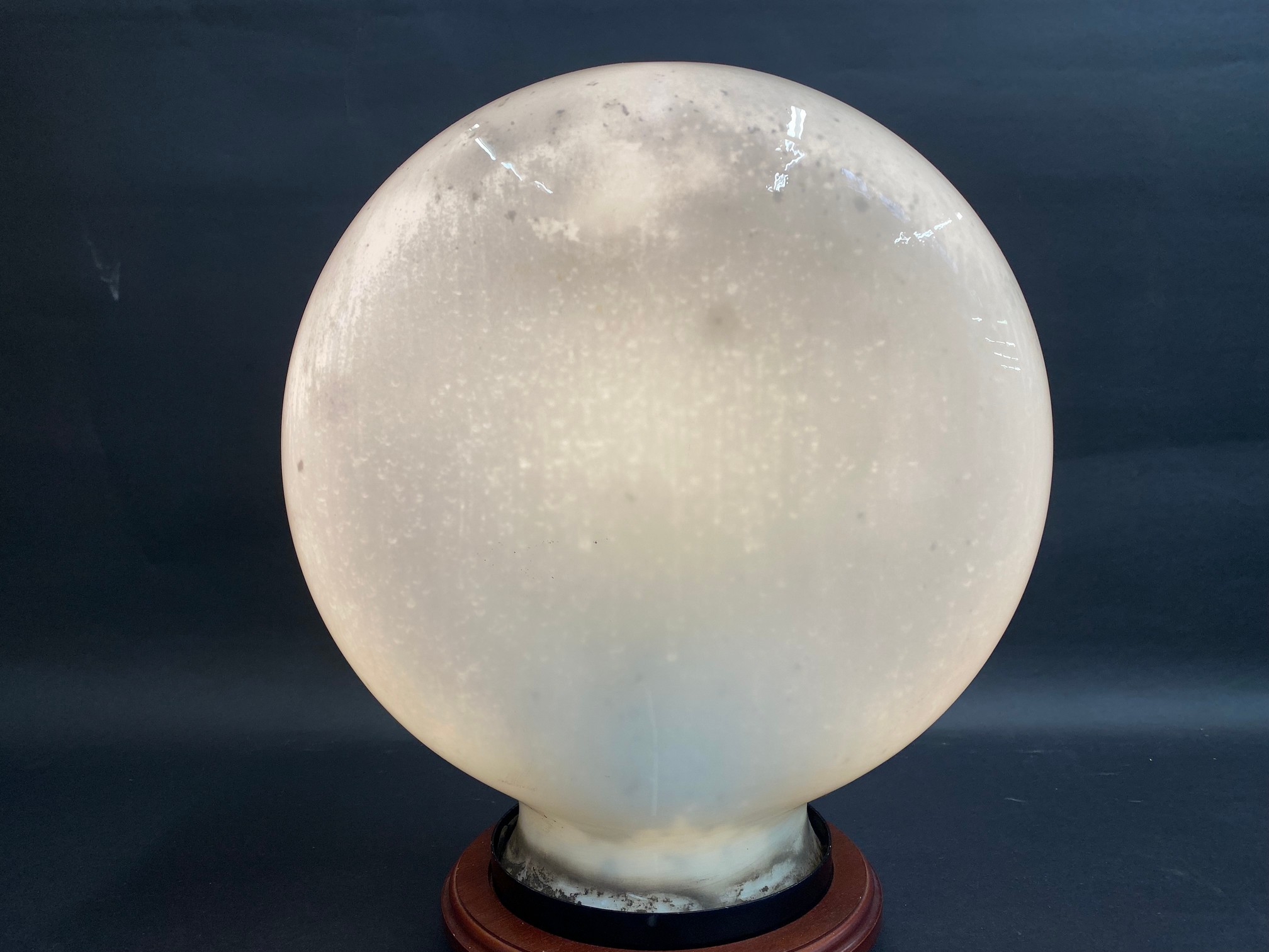 An early original pill shaped glass petrol pump globe, unlettered.