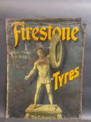 An early and rare Firestone Tyres pictorial tin advertising sign depicting 'The Colossus', trimmed
