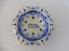 A blue and white ashtray advertising 'Girling - the best brakes in the world'.