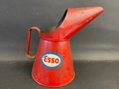 An Esso half gallon measure with bright decals.