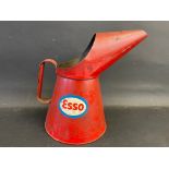 An Esso half gallon measure with bright decals.