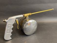 A chrome plated and polished brass Redex dispensing gun.