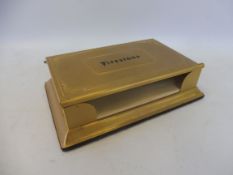 A Firestone tyres advertising brass paper note holder and calendar.