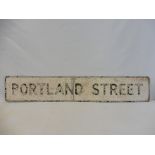 A street name sign for Portland Street, 51 x 9".