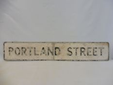 A street name sign for Portland Street, 51 x 9".