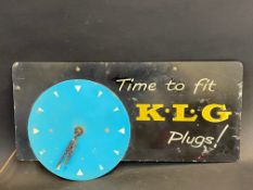 A K.L.G. Plugs advertising wall clock, 18 x 9 1/2".