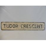 A street name sign for Tudor Crescent, 48 x 9".