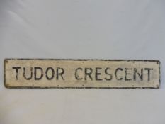 A street name sign for Tudor Crescent, 48 x 9".