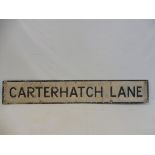 A street name sign for Carterhatch Lane, 56 x 9".