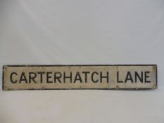 A street name sign for Carterhatch Lane, 56 x 9".