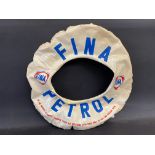 An inflatable swim ring advertising Fina Petrol.