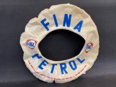 An inflatable swim ring advertising Fina Petrol.