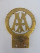 An early AA brass Stenson Cooke 'frying pan' car badge, hand engraved with the number 677, history