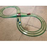 A Tipp & Co. clockwork race track set from the mid 1930s, with four car, by repute two still work.