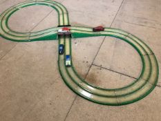 A Tipp & Co. clockwork race track set from the mid 1930s, with four car, by repute two still work.