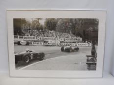 A large scale black and white photographic print of a circa 1960 race, 40 x 28".