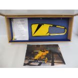 A framed Formula 1 Grand Prix exit duct from a Jordan 198 race car, serial number JO-245, with