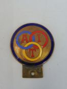 An Alliance INternationale de Tourisme brass and enamel car badge, enamel with a repair.