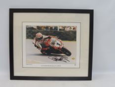 A framed and glazed signed Carl Fogarty photograph, celebrating four times World Superbike Champion,