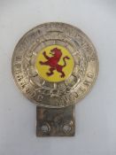 A Royal Scottish Auto Cycle Union Club car badge with yellow and red prancing lion centre.