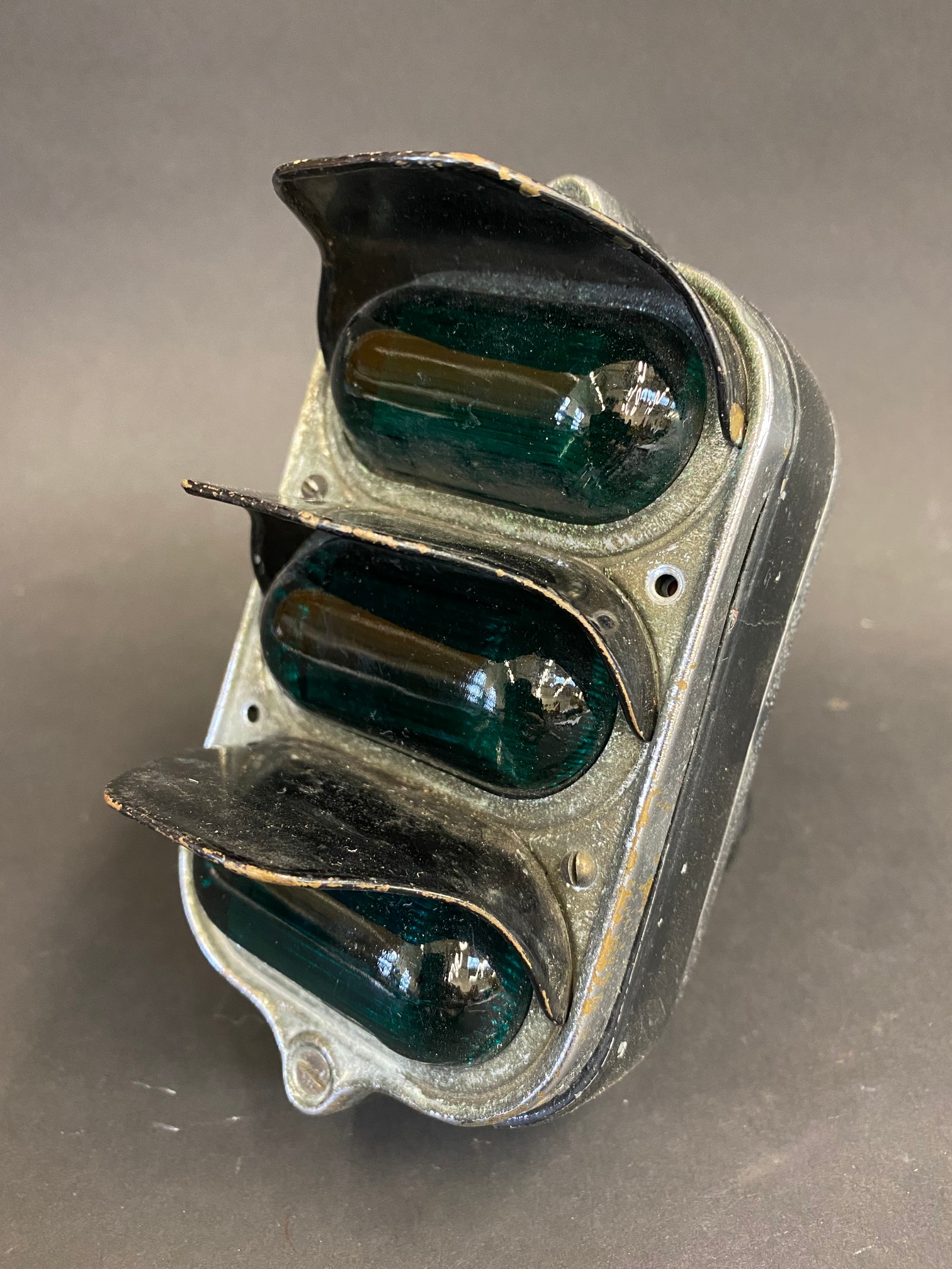 A 1930s windscreen pillar mounted set of 'traffic light' style indicators as fitted to Morris