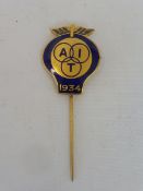 A good quality AA gilded and blue enamel tie pin bearing the letters 'AIT' 1934 (Alliance
