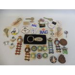 A collection of assorted RAC enamel and plastic badges including two Rally of Great Britain enamel